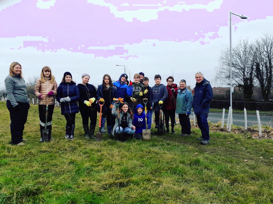 WEG volunteers with spades